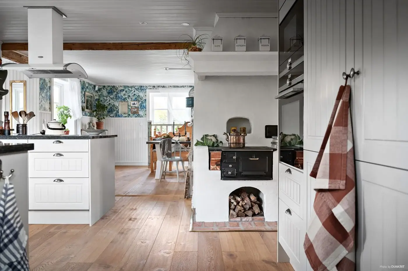 A Charming Swedish Villa Filled with Wallpaper 9 white-country-kitchen-stove-nordroom