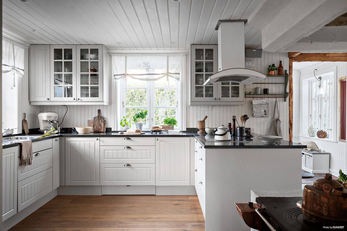A Charming Swedish Villa Filled with Wallpaper 8 white-country-kitchen-swedish-home-nordroom
