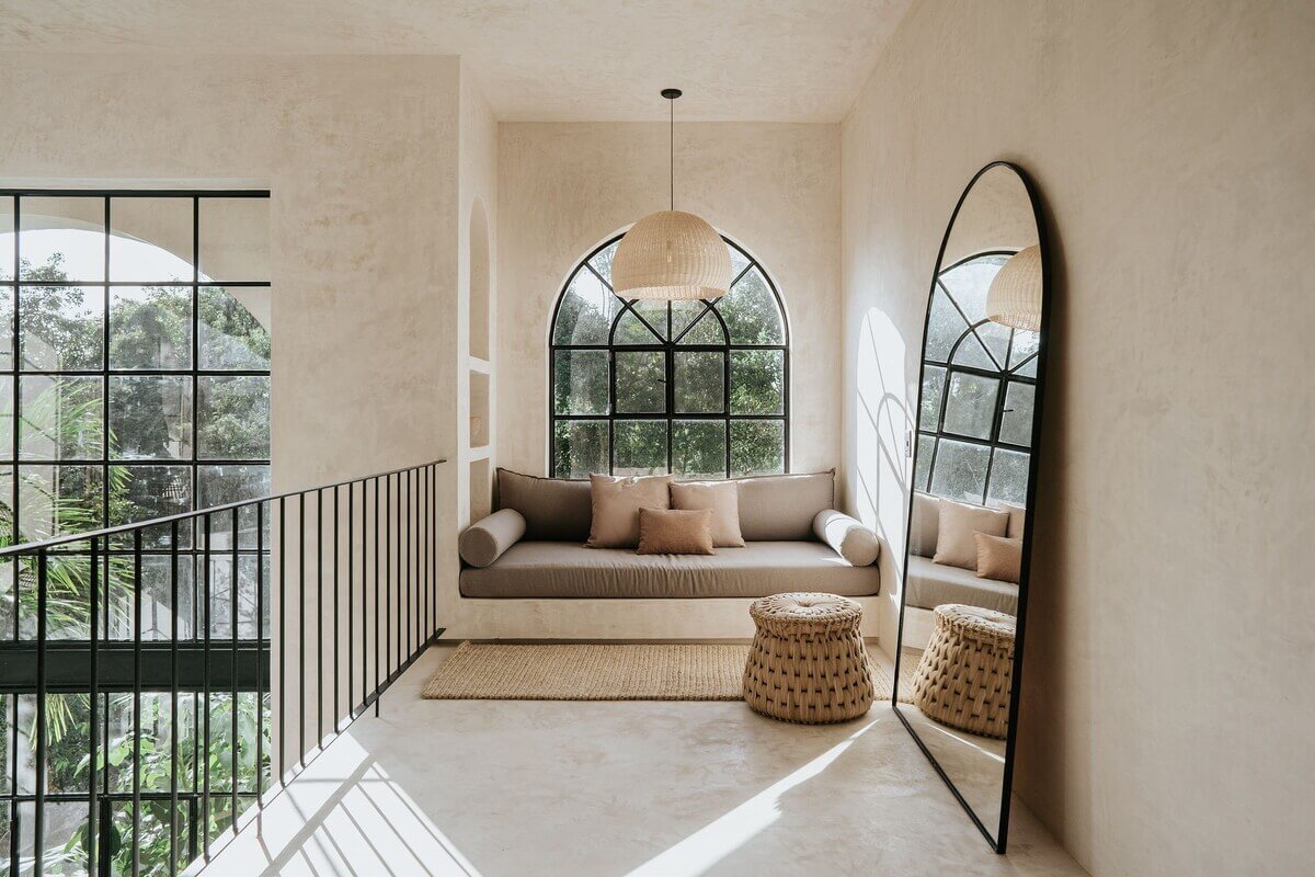 A Serene Apartment in Tulum with High Ceilings and Rooftop Pool 25 window-seat-arched-window-nordroom