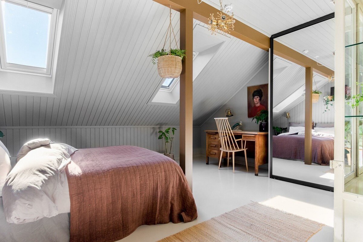 A Charming Attic Apartment Decorated with Color 29 attic-bedroom-exposed-beams-soft-pink-decor-nordroom