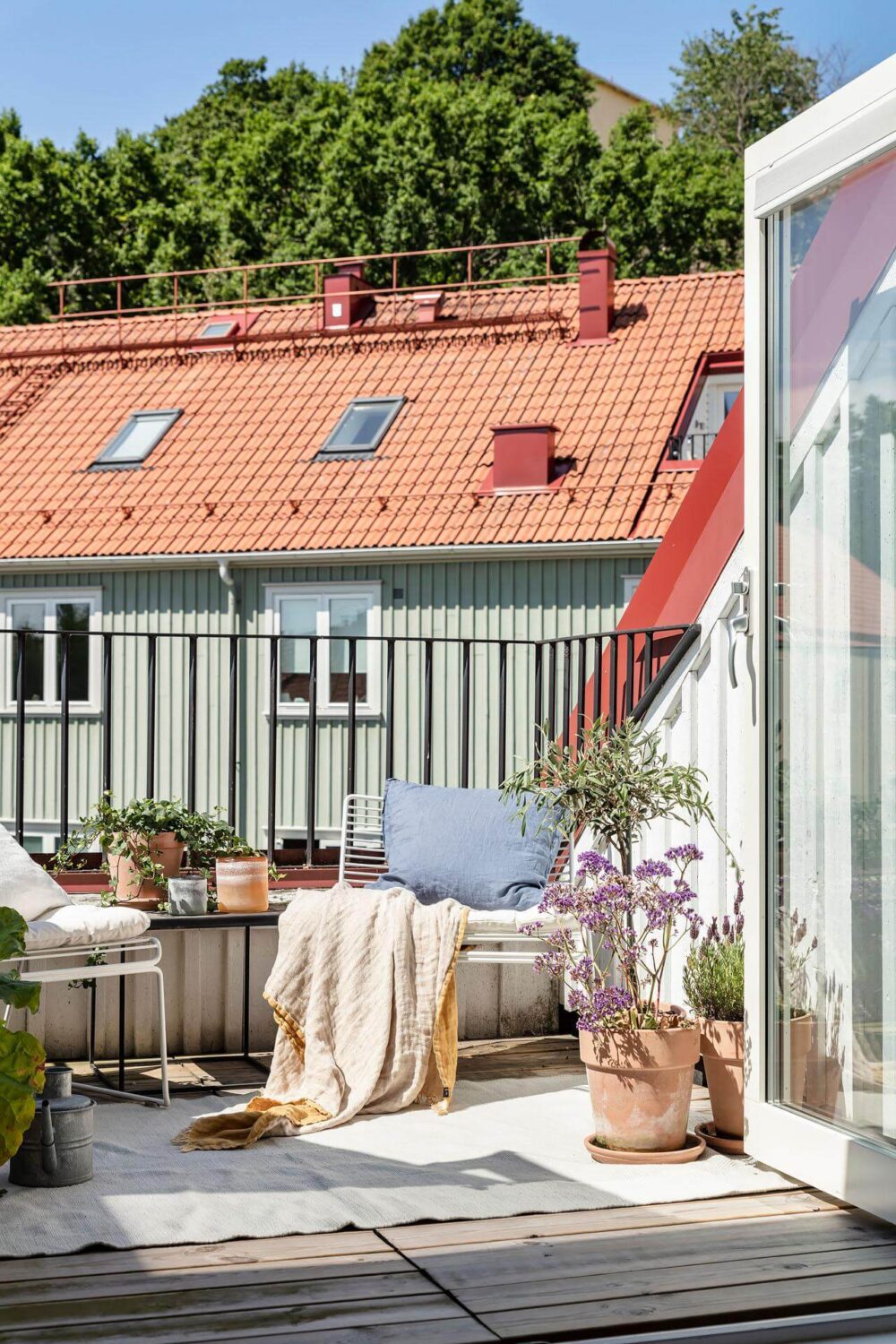 A Living Room with Pink Accents in a Light Attic Apartment 9 balcony-attic-apartment-sweden-nordroom