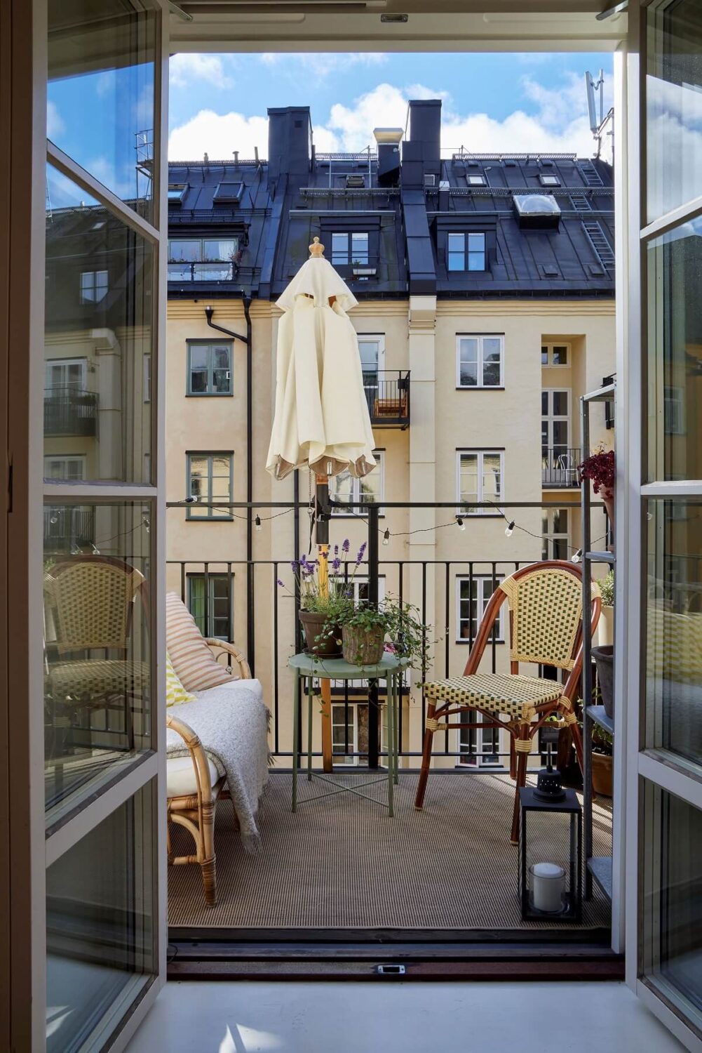 A Small Nordic Home Decorated in Warm Light Colors 14 bedroom-balcony-overlooking-courtyard-stockholm-nordroom