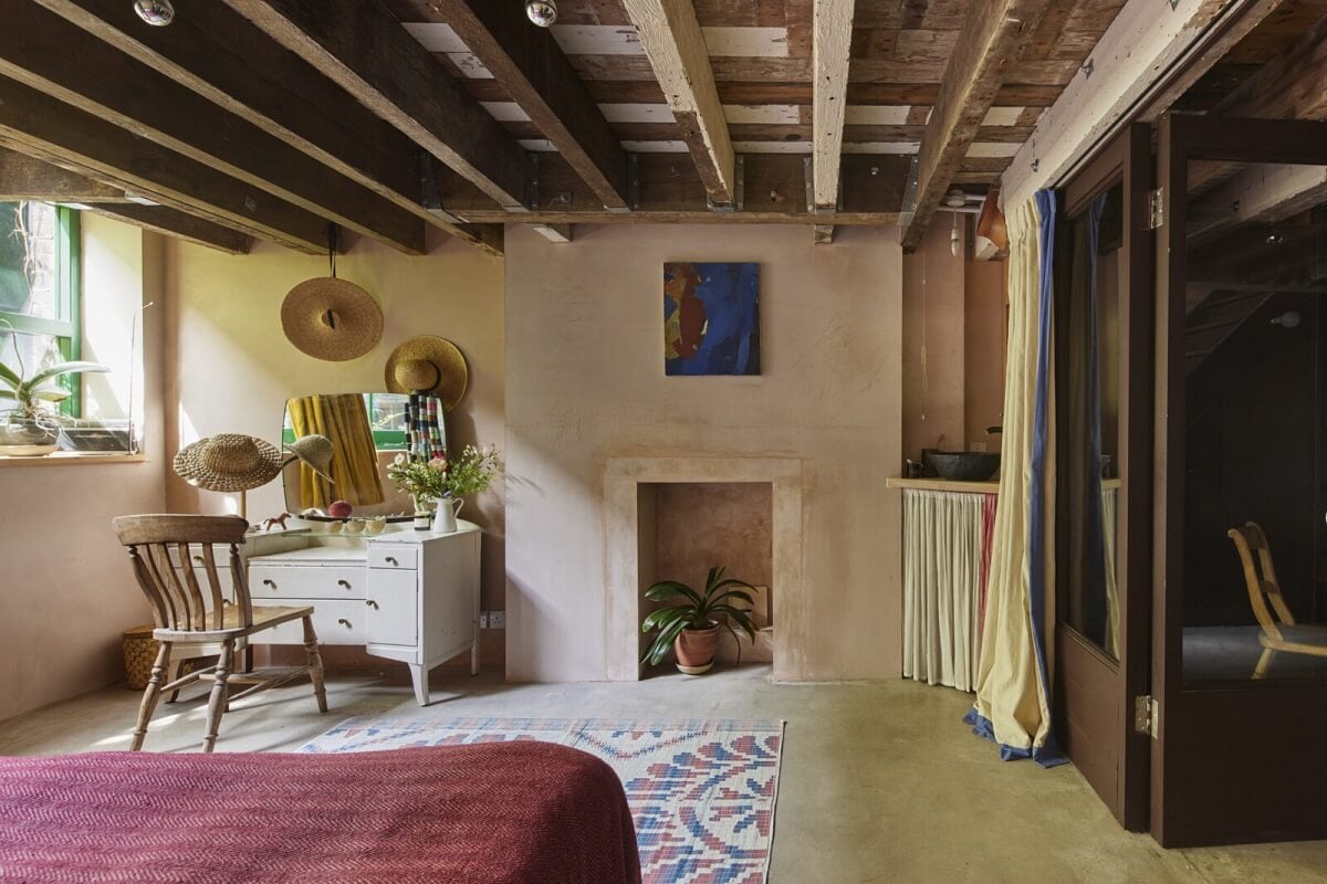 A Unique Home in a Former Furniture Workshop 18 bedroom-plastered-walls-exposed-wooden-ceiling-fireplace-nordroom