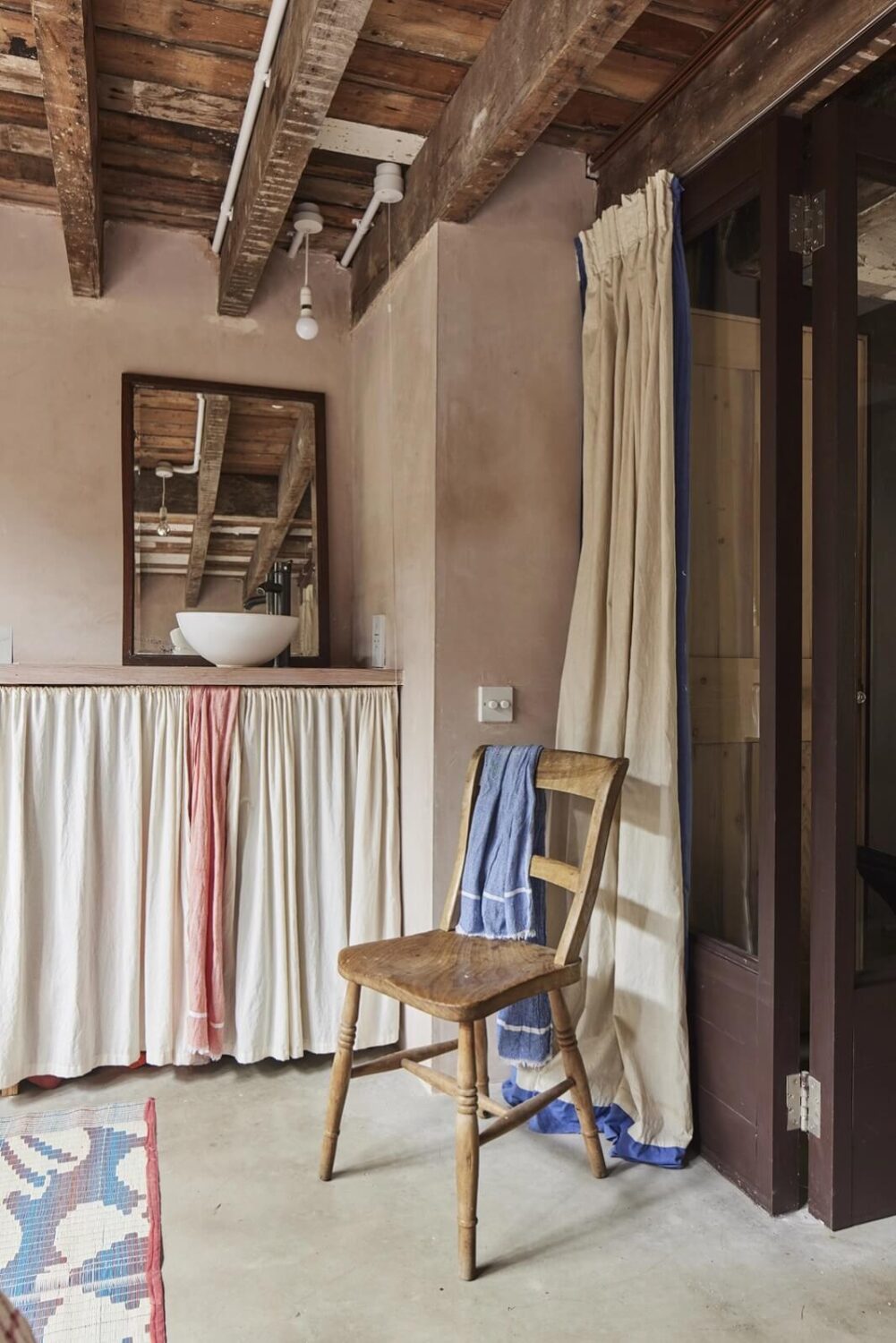 A Unique Home in a Former Furniture Workshop 15 bedroom-sink-plastered-walls-wooden-ceiling-nordroom