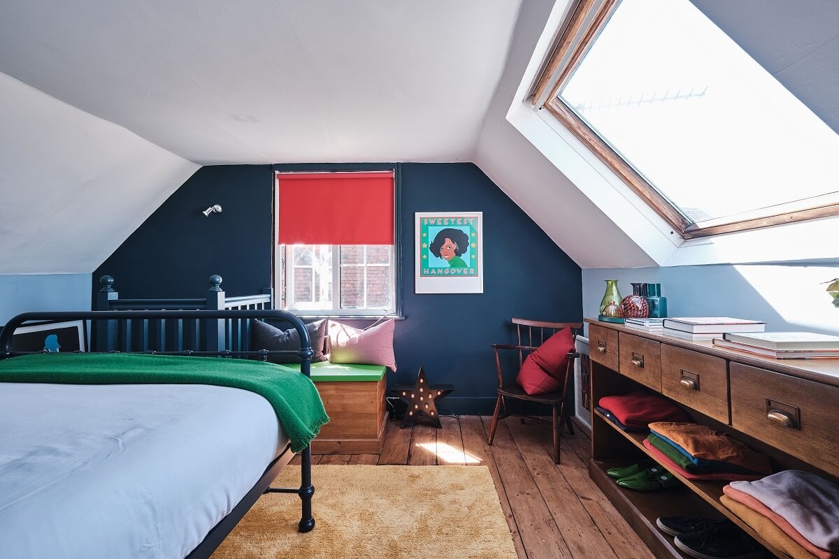 Bold Colors in a Charming English Cottage 17 bedroom-wooden-floor-blue-walls-sloped-ceiling-english-cottage-nordroom