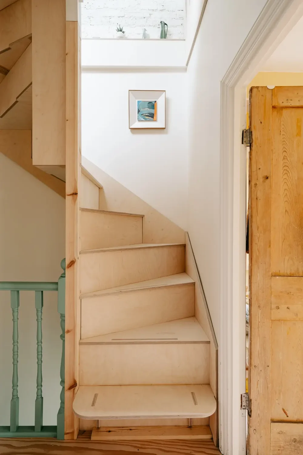 A London Home with Modern Extension and Color Accents 15 birch-plywood-staircase-london-home-nordroom