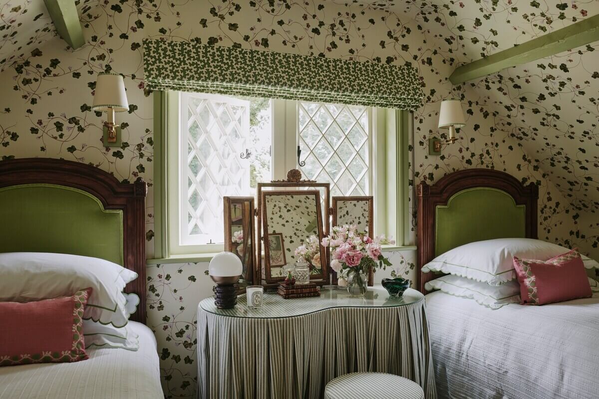 A Magical Pink Cottage in the English Countryside 11 cottage-bedroom-sloped-ceilings-green-wallpaper-nordroom