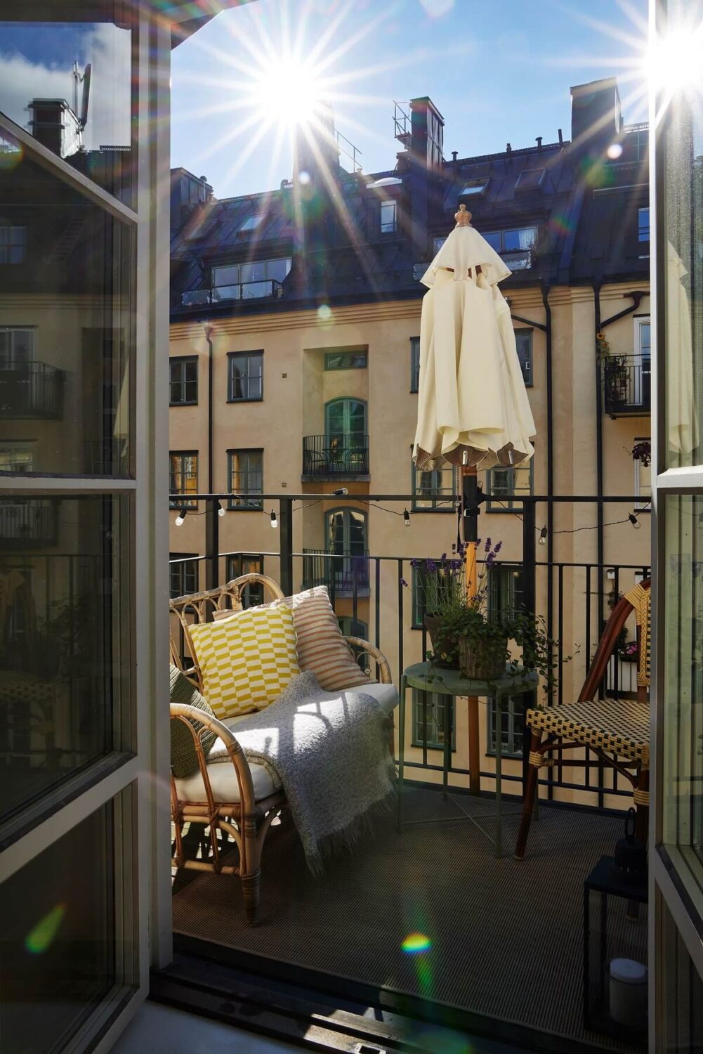 A Small Nordic Home Decorated in Warm Light Colors 15 courtyard-balcony-small-stockholm-apartment-nordroom