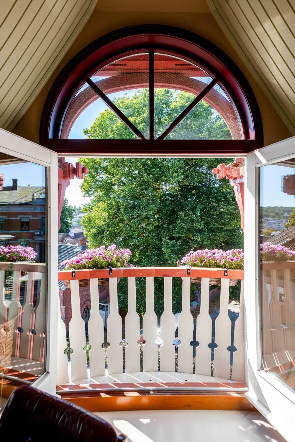 A Charming Attic Apartment Decorated with Color 7 french-balcony-pink-doors-nordroom
