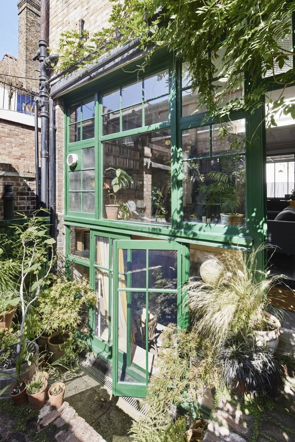 A Unique Home in a Former Furniture Workshop 20 glass-facade-green-trims-apartment-furniture-workshop-london-nordroom