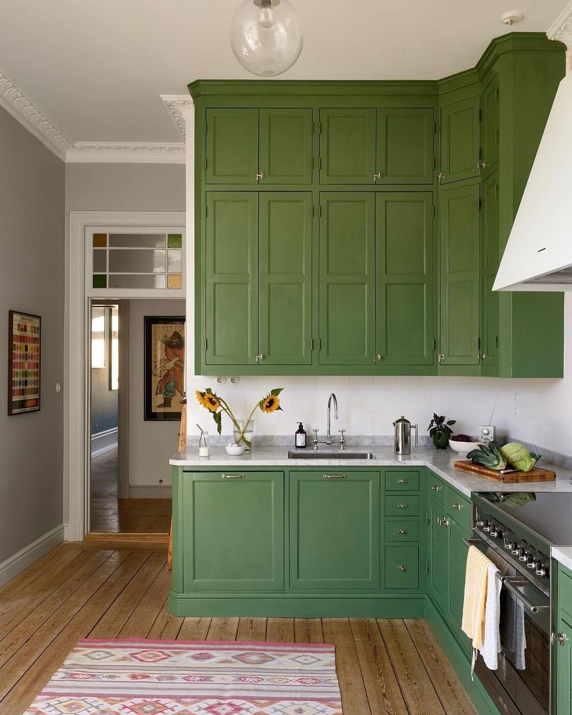 A Swedish Family Home Packed With Color 4 green-kitchen-cabinets-colorful-nordic-home-nordroom