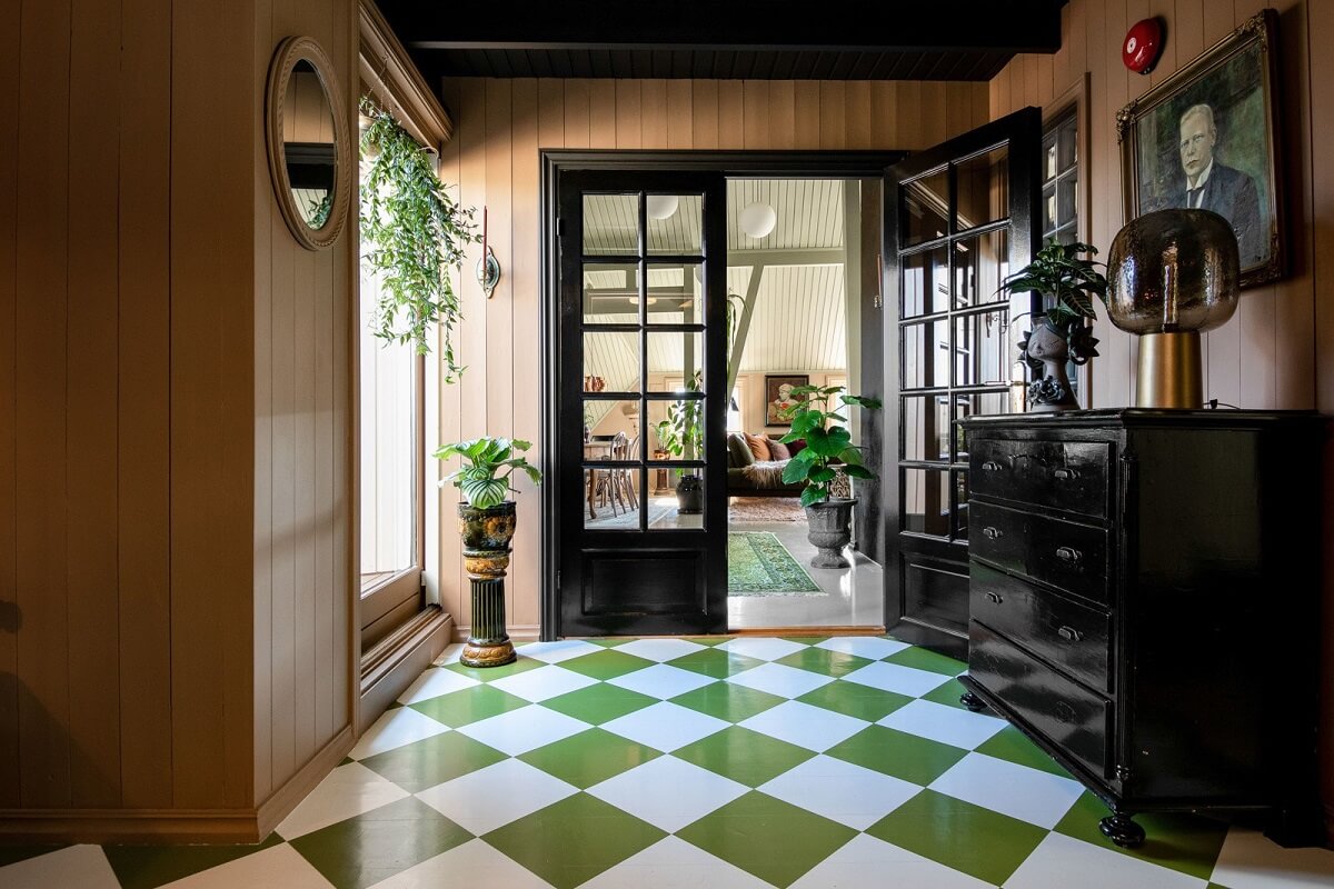 A Charming Attic Apartment Decorated with Color 18 hallway-green-white-checkerboard-floor-black-door-nordroom