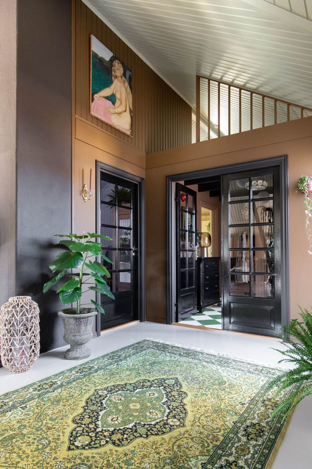 A Charming Attic Apartment Decorated with Color 17 hallway-loft-space-earthy-wall-color-black-door-nordroom