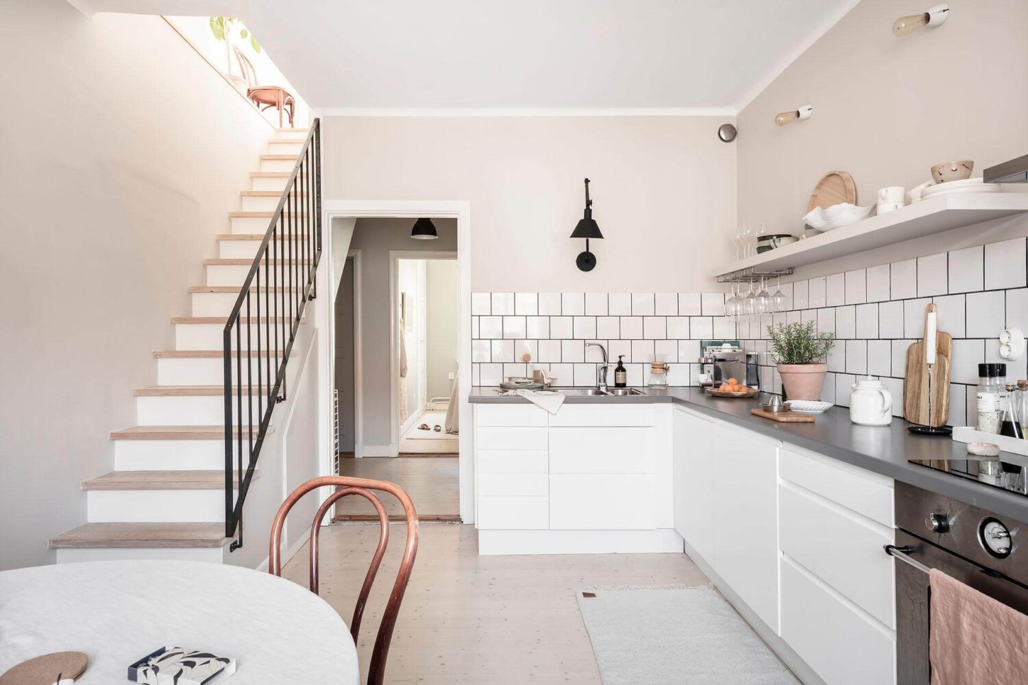 A Living Room with Pink Accents in a Light Attic Apartment 16 kitchen-scandinavian-design-white-cabinets-nordroom