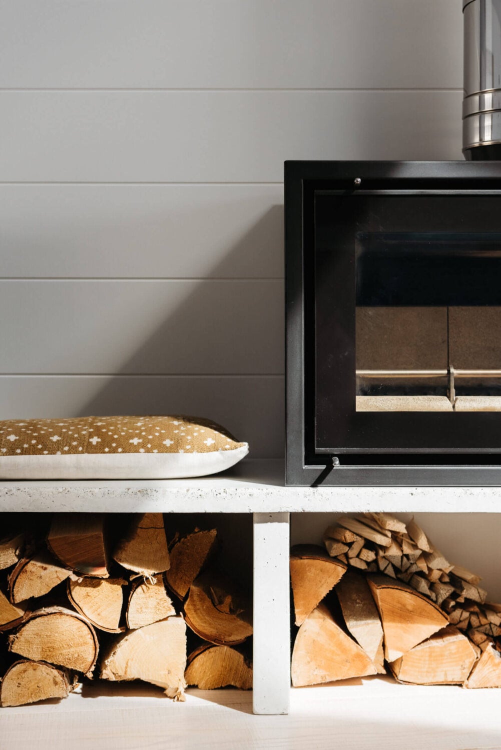 A Beautiful Duplex Apartment in Cornwall 5 living-room-detail-woodburner-bench-nordroom