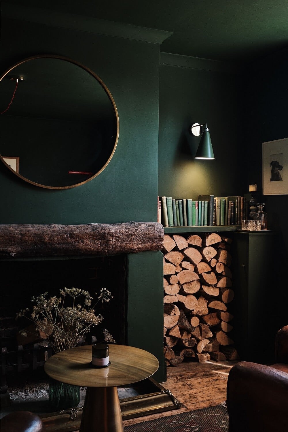 Bold Colors in a Charming English Cottage 2 moody-green-sitting-room-fireplace-woodblocks-english-cottage-nordroom