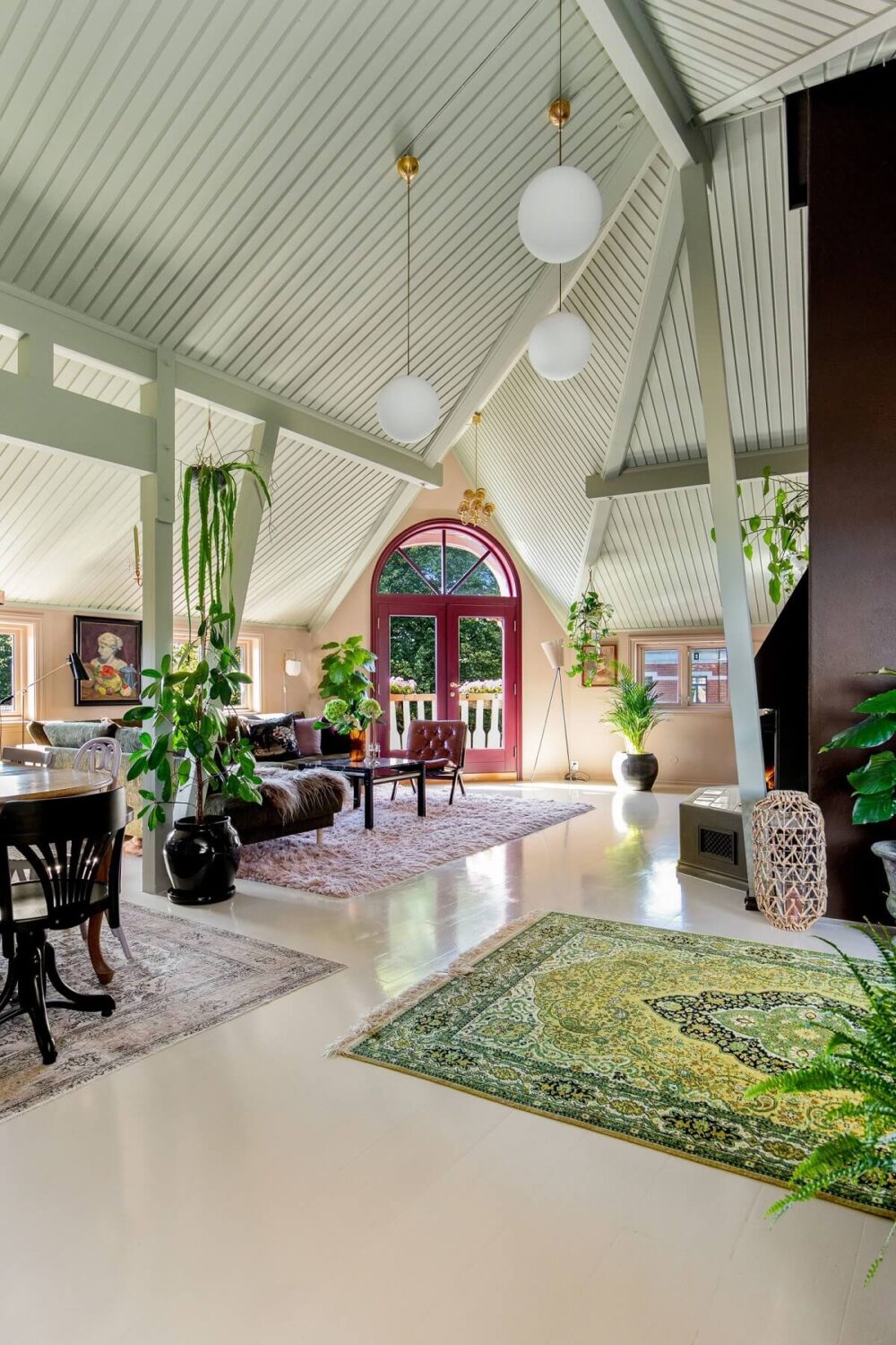 A Charming Attic Apartment Decorated with Color 1 open-plan-attic-living-space-green-rug-nordroom
