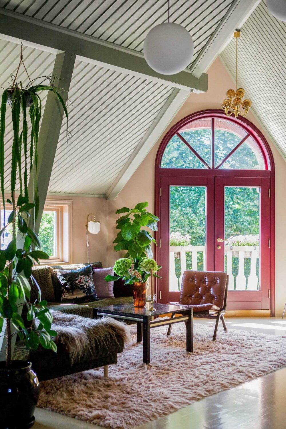 A Charming Attic Apartment Decorated with Color 6 open-plan-living-space-pink-balcony-door-nordroom