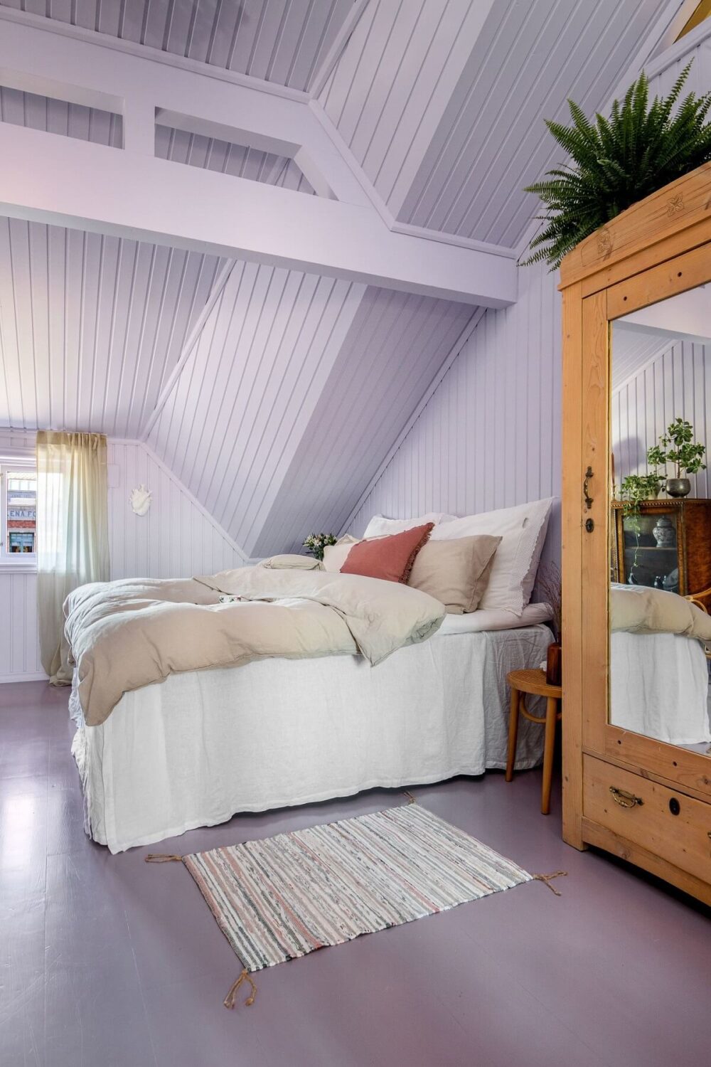 A Charming Attic Apartment Decorated with Color 21 pastel-purple-attic-bedroom-nordroom