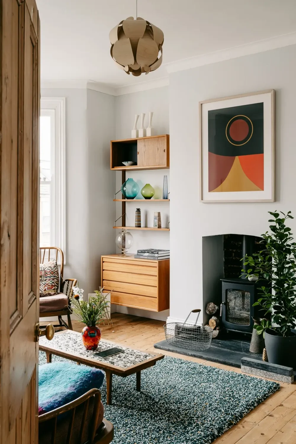 A London Home with Modern Extension and Color Accents 6 sitting-room-bay-window-light-gray-walls-castiron-stove-nordroom