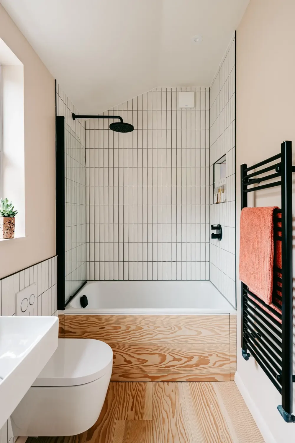 A London Home with Modern Extension and Color Accents 14 small-bathroom-douglas-fir-floor-black-fittings-nordroom