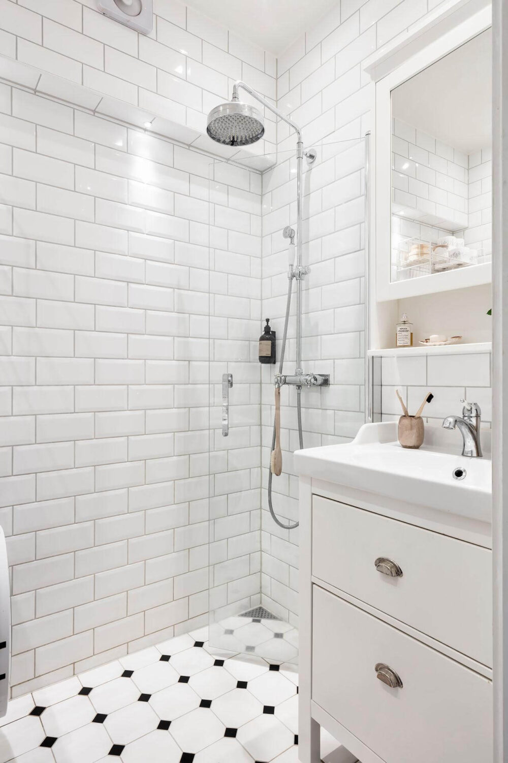 A Living Room with Pink Accents in a Light Attic Apartment 19 small-bathroom-white-tiles-nordroom