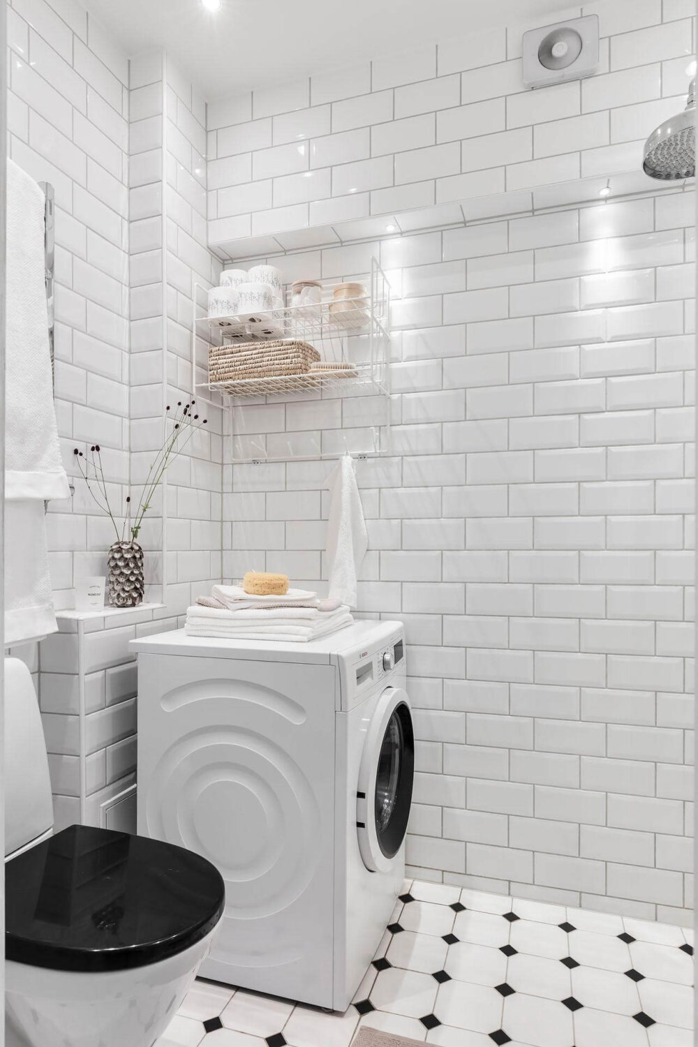 A Living Room with Pink Accents in a Light Attic Apartment 20 small-bathroom-white-tiles-nordroom (2)