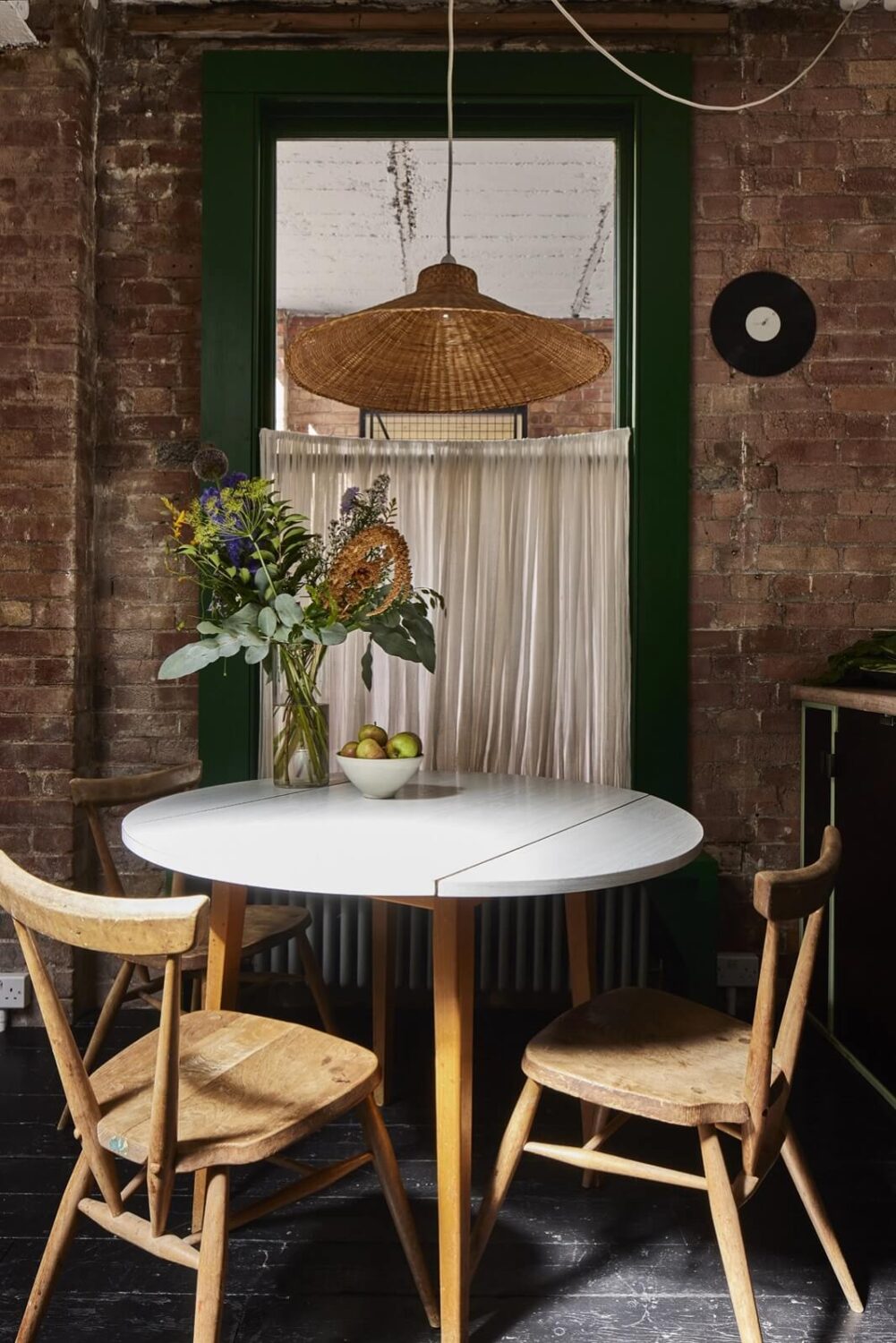 A Unique Home in a Former Furniture Workshop 7 small-round-dining-table-brick-walls-nordroom