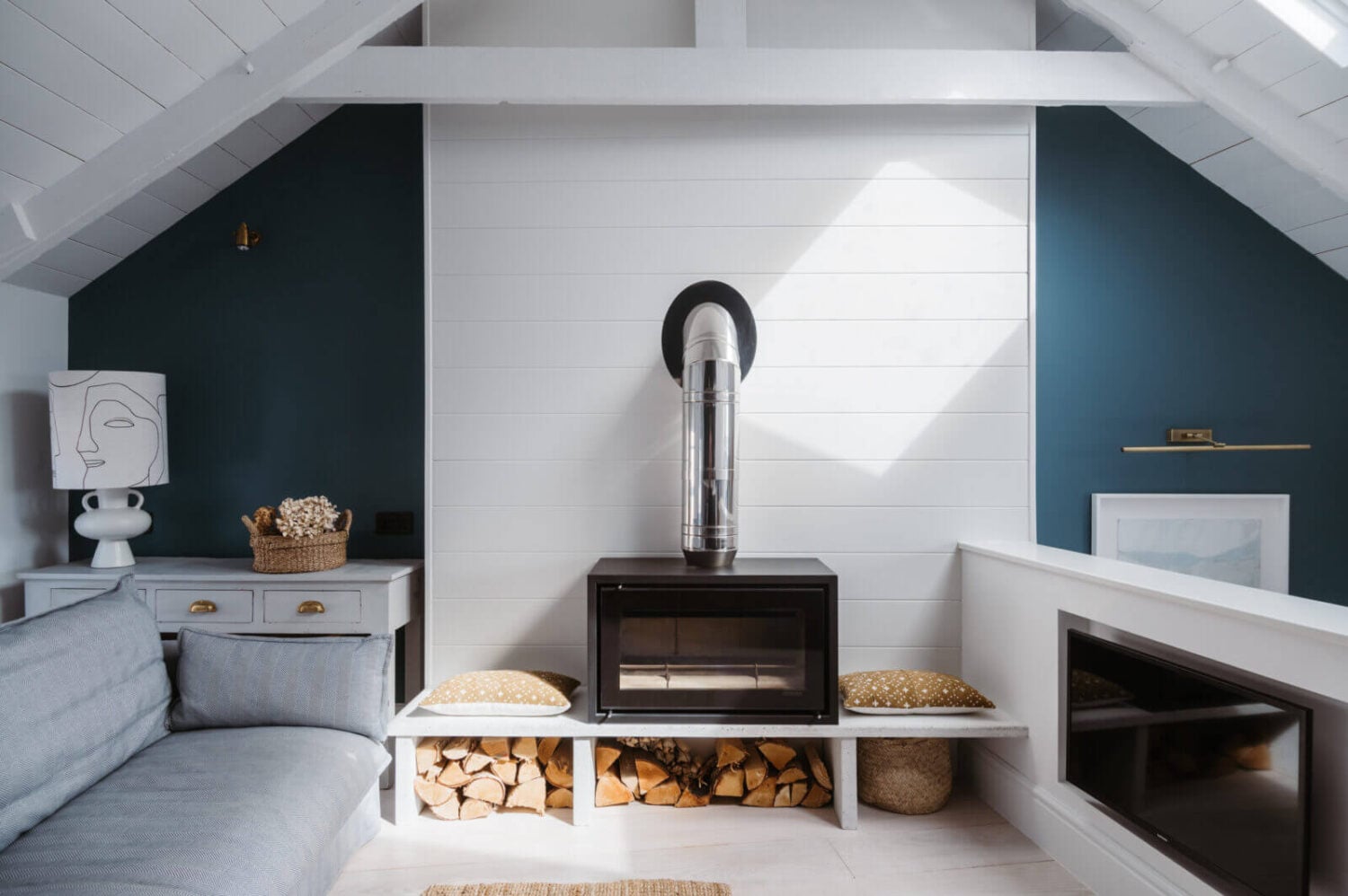 A Beautiful Duplex Apartment in Cornwall 4 small-sitting-room-woodburner-blue-walls-nordroom