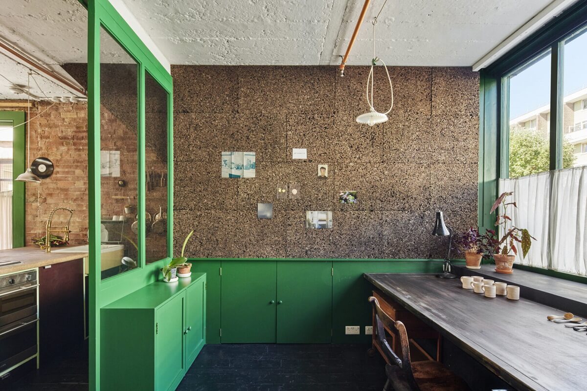 A Unique Home in a Former Furniture Workshop 8 studio-space-brick-walls-deep-brunswick-green-cabinets-nordroom