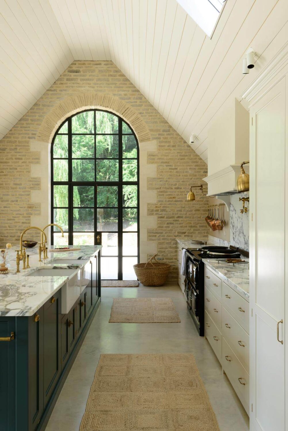 57 Stylish Two-Tone Kitchen Cabinet Ideas 34 arched-window-concrete-floor-kitchen-nordroom