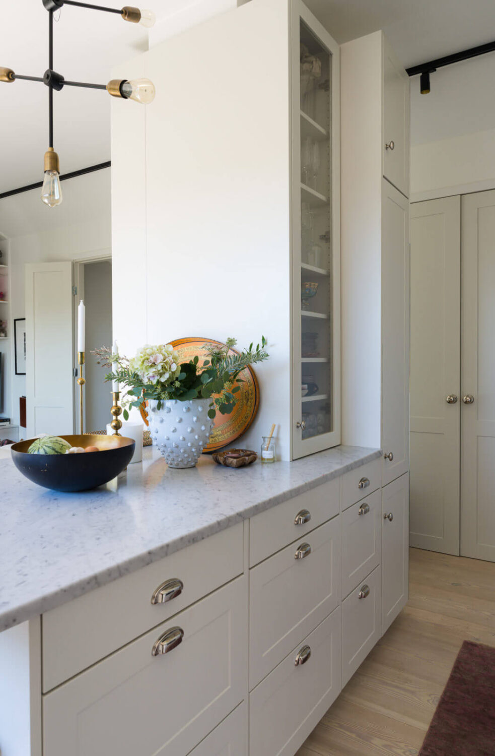 A Small Attic Apartment with Plenty of Storage 8 attic-apartment-white-kitchen-cabinets-nordroom