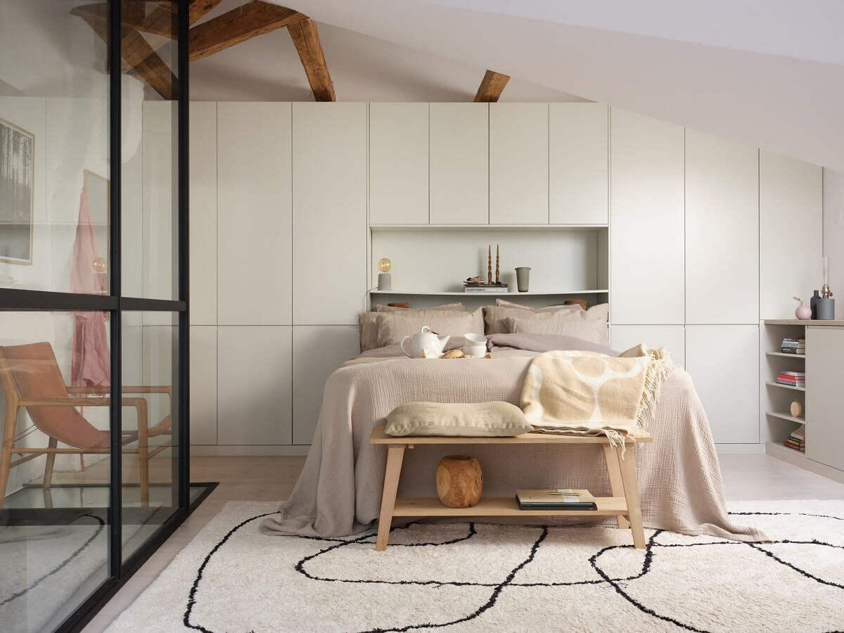 A Stylish Nordic Apartment with Attic Bedroom 19 attic-bedroom-slanted-ceiling-exposed-beams-built-in-wardrobes-nordroom