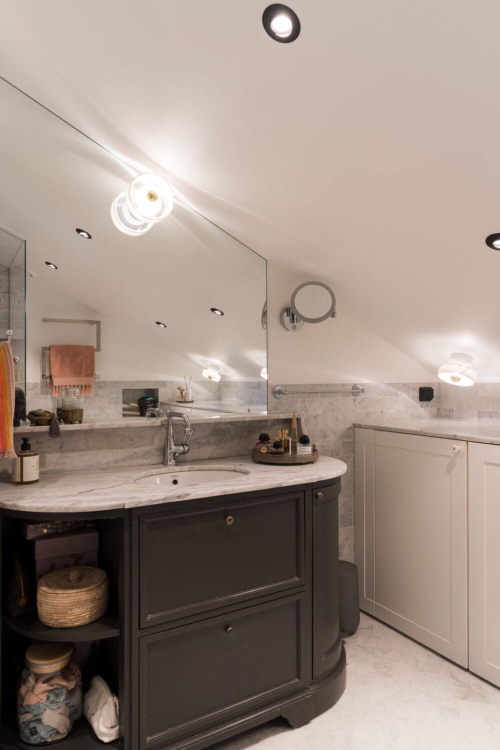 A Small Attic Apartment with Plenty of Storage 15 bathroom-sloped-ceiling-vintage-style-vanity-cabinet-nordroom