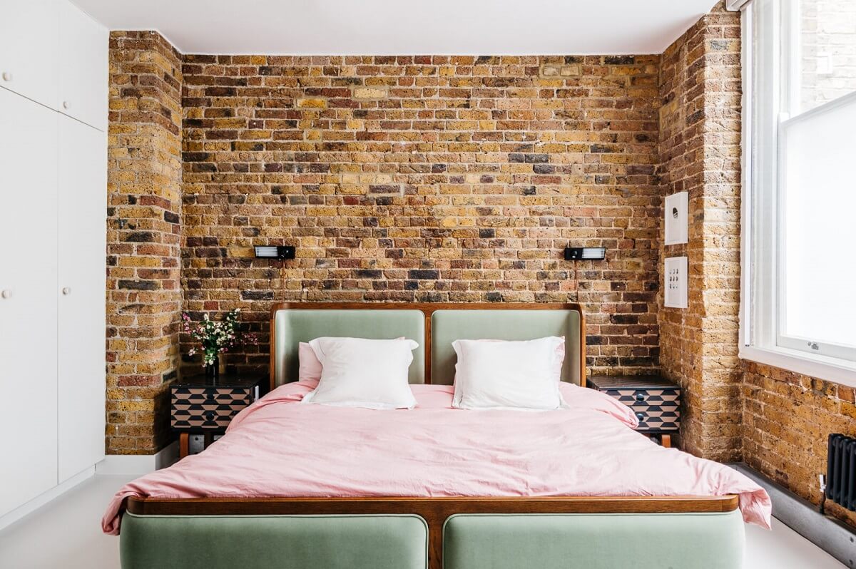 A Modern Apartment with Exposed Brick Walls and Color Accents 10 bedroom-green-bed-exposed-brick-walls-warehouse-apartment-london-nordroom