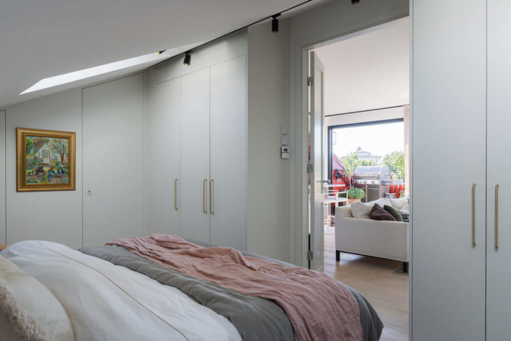 A Small Attic Apartment with Plenty of Storage 12 bedroom-sloped-ceiling-built-in-wardrobes-nordroom