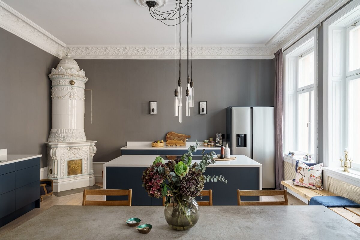 A Classic Nordic Apartment Decorated with Modern Furnishings and Color 10 blue-kitchen-dining-room-fireplace-gray-walls-nordroom