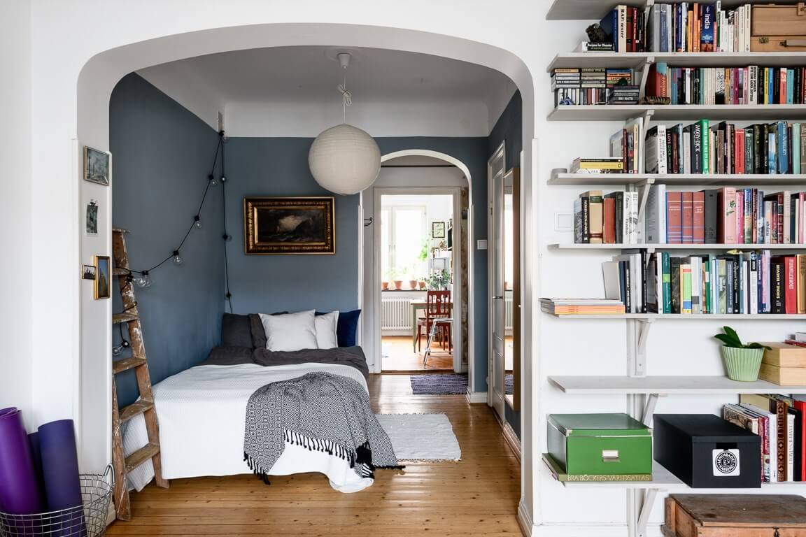 Great Living Room Bedroom Combo Ideas (Layout Tips + Styling) 20 blue-painted-bedroom-nook-one-room-apartment-nordroom