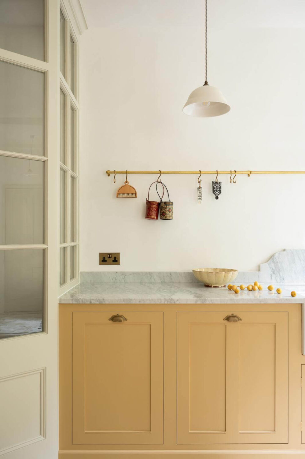 A deVOL Kitchen with Butter Yellow Cabinets 9 brass-hanging-rail-devol-kitchens-yellow-cabinets-nordroom