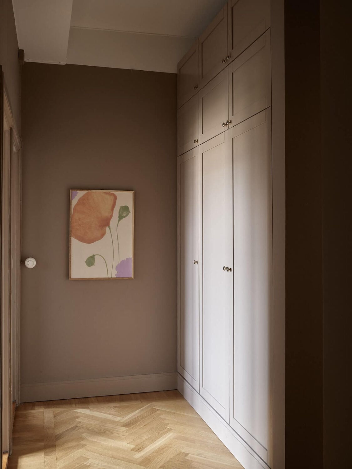 A Warm Nordic Apartment with Light Brown Walls 22 brown-hallway-built-in-wardrobes-nordroom