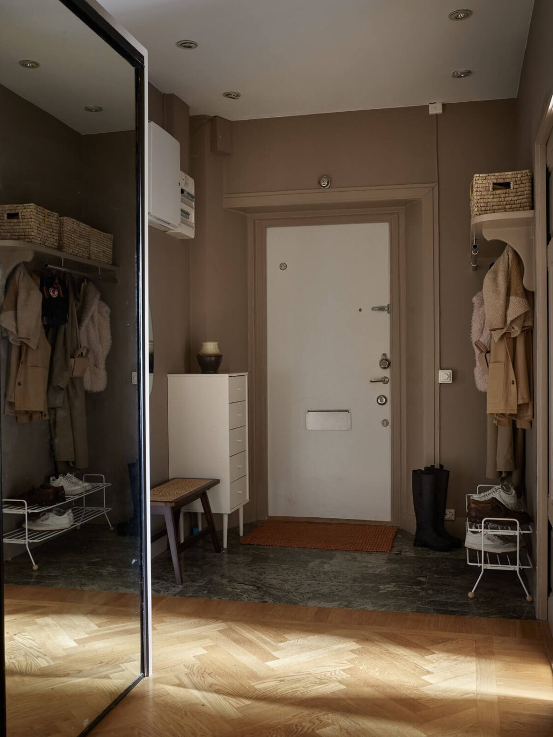 A Warm Nordic Apartment with Light Brown Walls 23 brown-hallway-mirror-closet-wooden-floor-nordroom