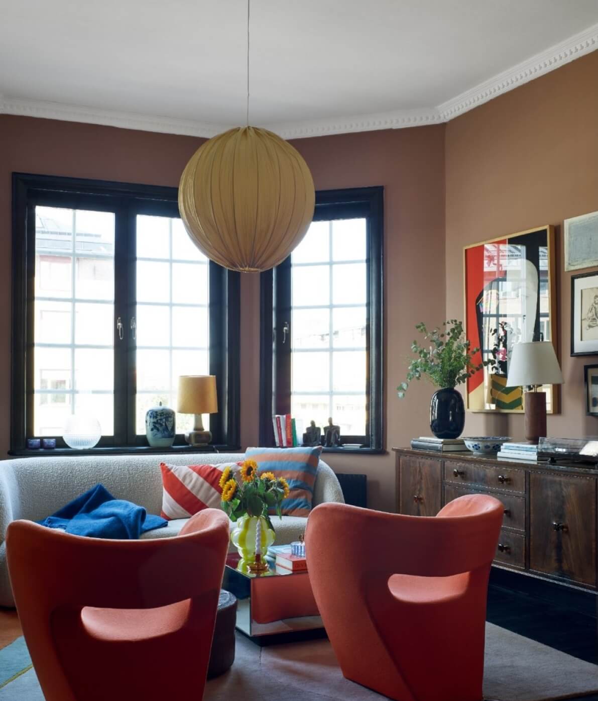 A Colorful Nordic Apartment with Dusty Pink Walls 5 colorful-living-room-pink-walls-black-trimmings-nordroom
