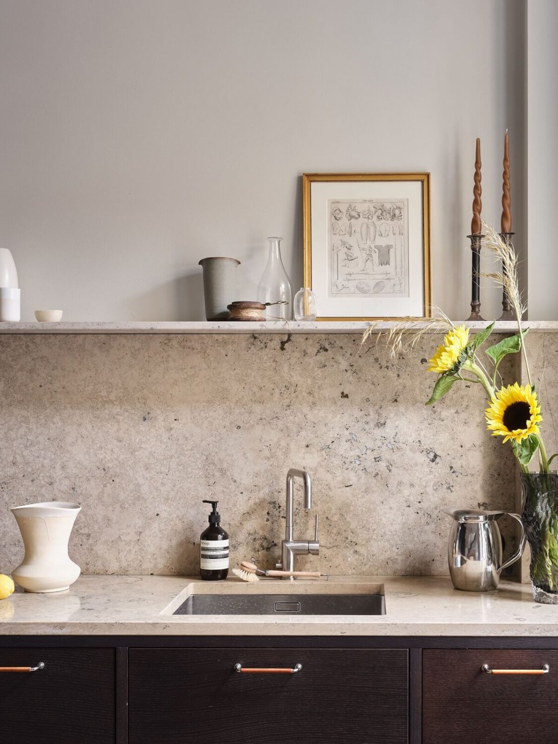 A Stylish Nordic Apartment with Attic Bedroom 11 dark-kitchen-cabinets-portuguese-limestone-worktop-nordroom