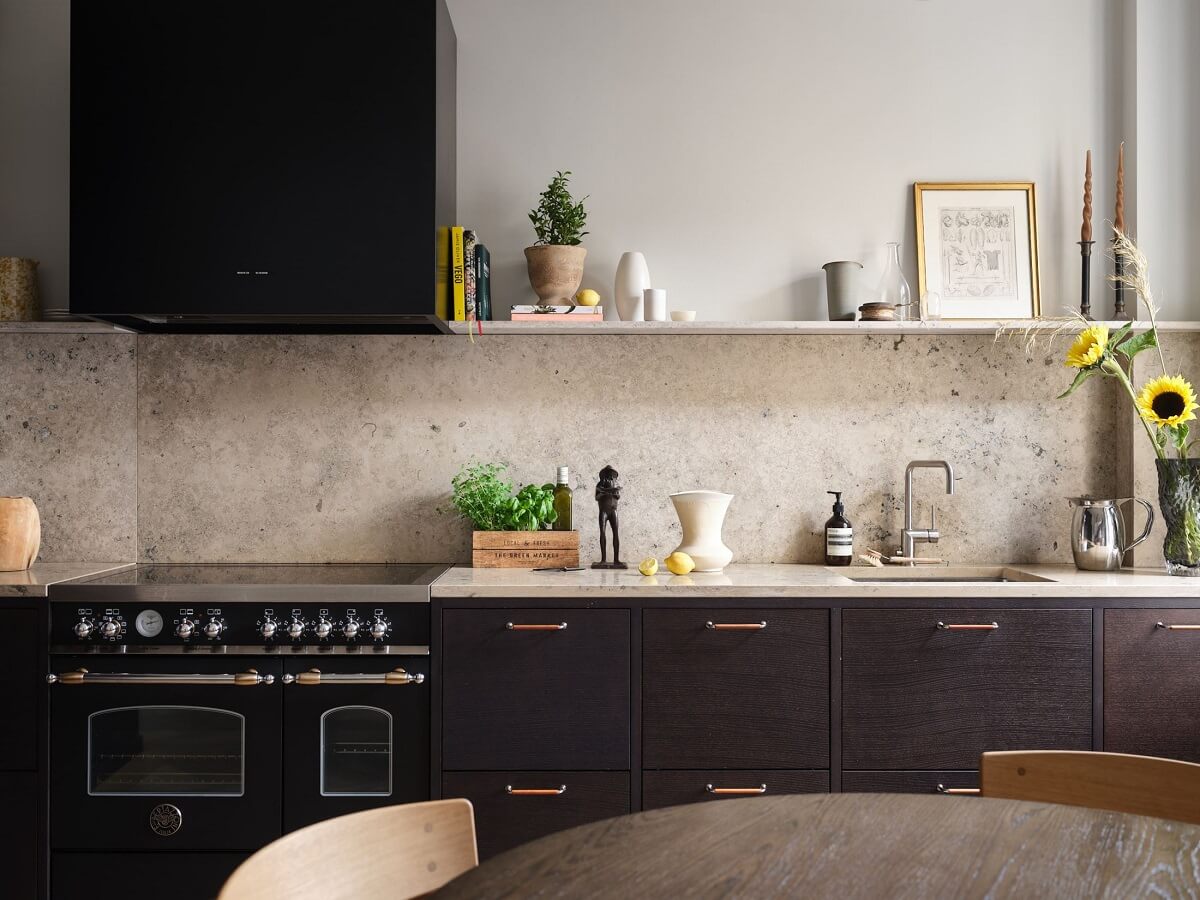 A Stylish Nordic Apartment with Attic Bedroom 10 dark-wooden-kitchen-portuguese-limestone-worktop-backsplash-nordroom