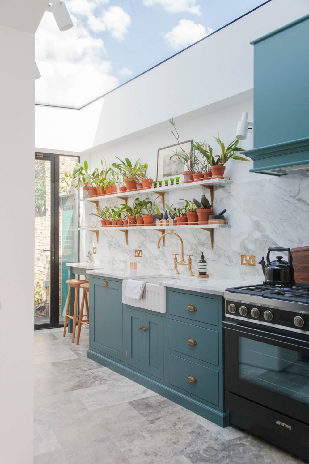 Beautiful Kitchens with Skylights That Add Light and Style 22 devol-kitchen-blue-cabinets-large-modern-roof-window-nordroom
