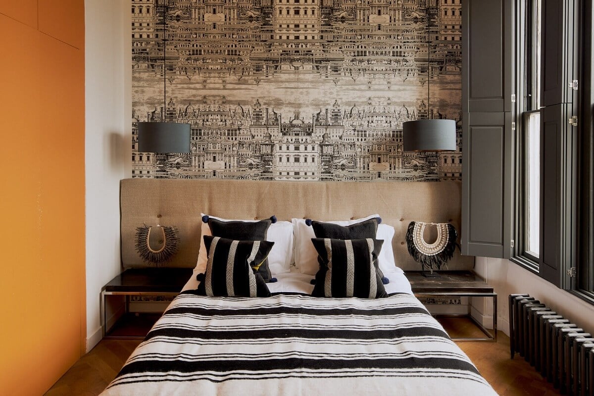 A Beautiful London Apartment in an Italianate Style Villa 11 fornasetti-wallpaper-cole-and-son-bedroom-gray-shutters-orange-wardrobes-nordroom