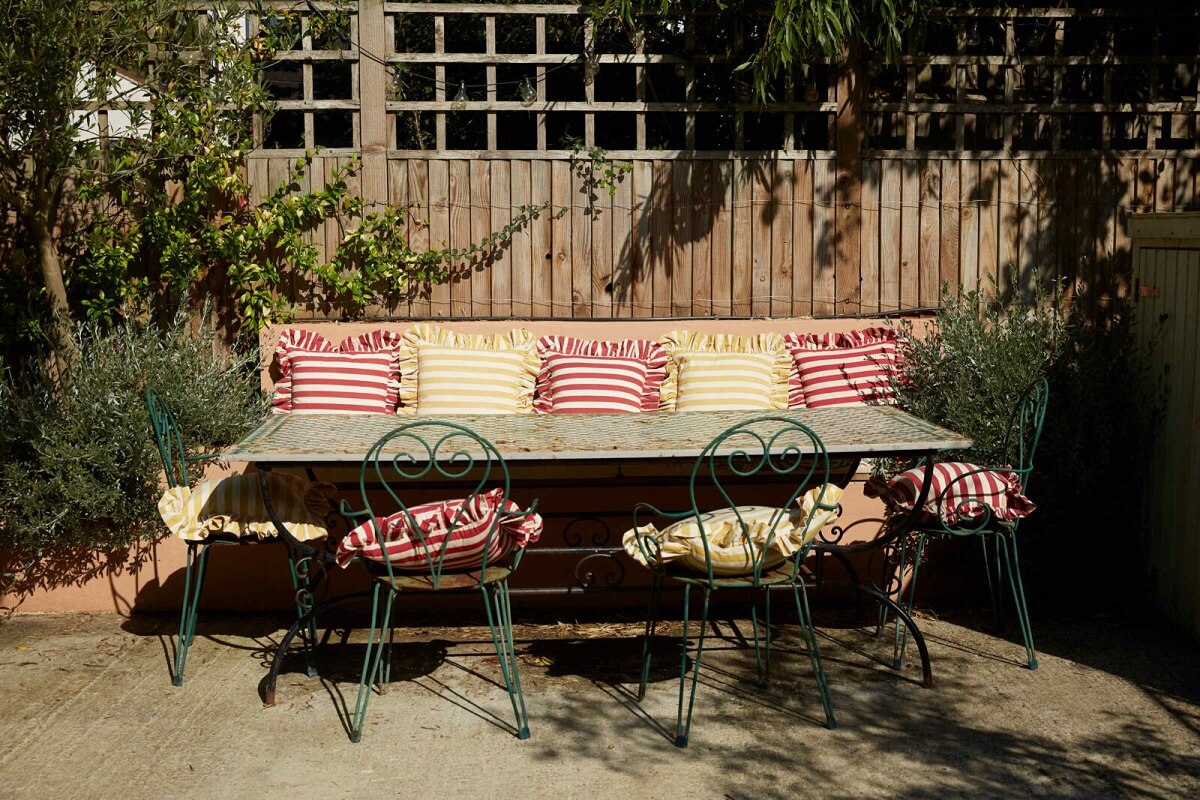 A Colorful Eclectic House Designed by Alice Palmer 27 garden-dining-area-bench-nordroom