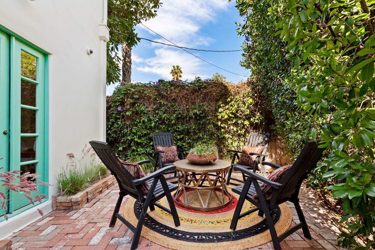 A Bright Spanish-Style Villa in Los Angeles 36 garden-terrace-light-blue-doorframes-nordroom