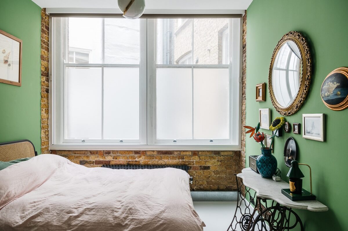 A Modern Apartment with Exposed Brick Walls and Color Accents 13 green-bedroom-brick-walls-warehouse-apartment-london-nordroom