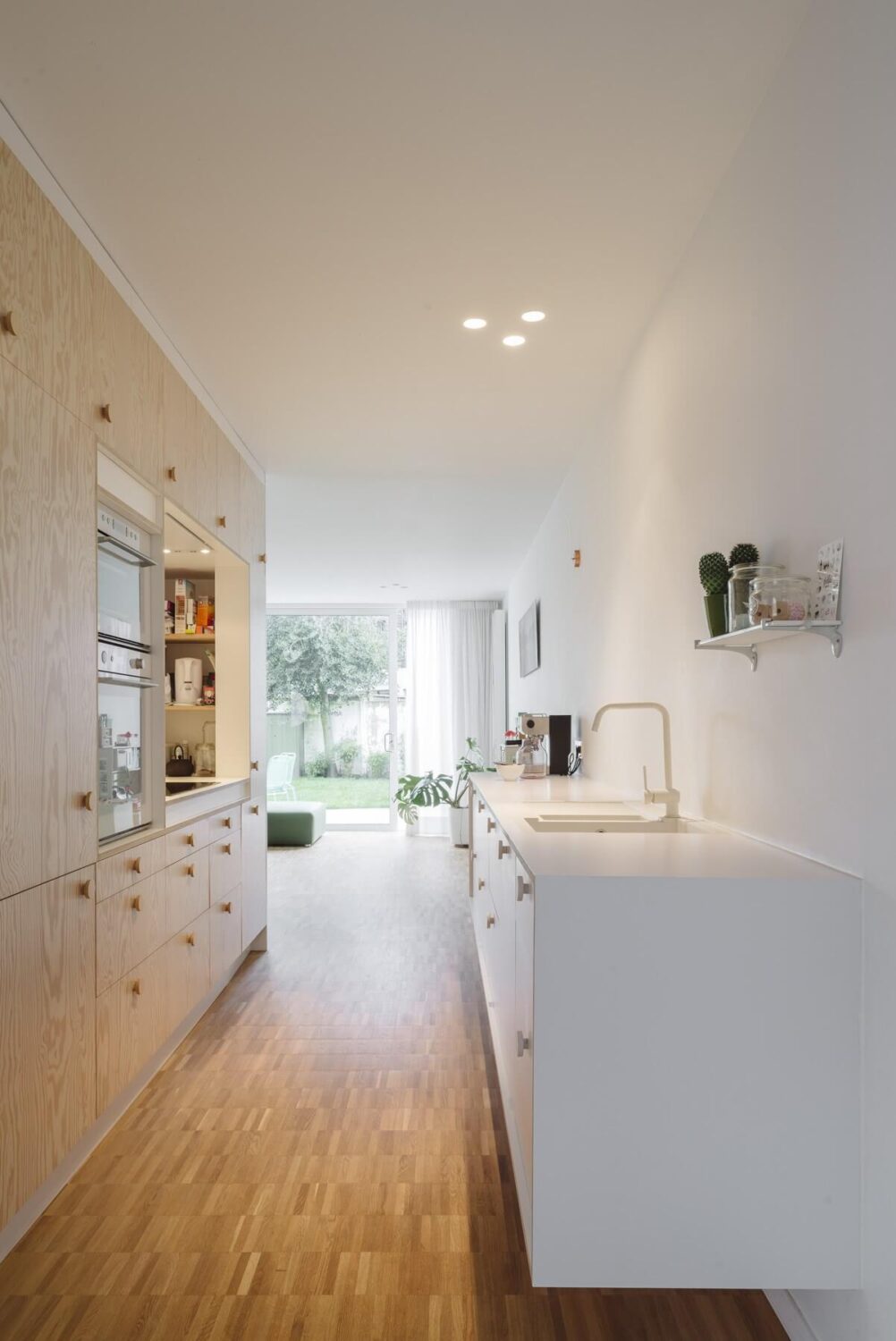 31 Practical Kitchen Flooring Ideas For Your Home 32 kitchen-bamboo-floor-floating-kitchen-modern-architecture-nordroom